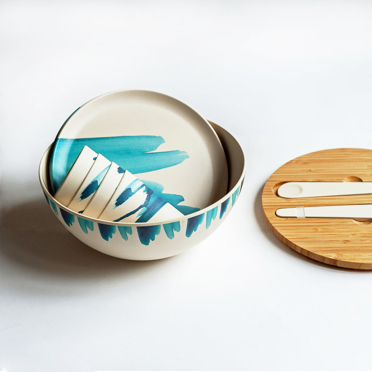 http://emilieoconnorhomestore.com/cdn/shop/products/Bamboodinnerwaresetwithbluewavedesignlidoff_1200x1200.jpg?v=1631757113