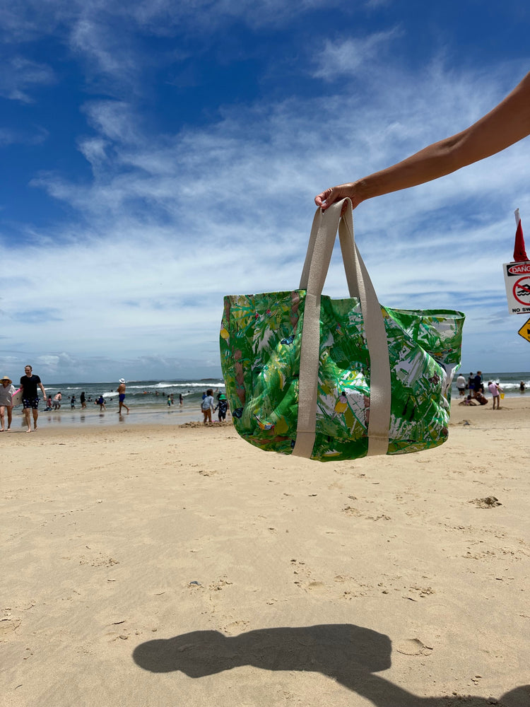 large beach bag made with strong organic cotton and printed with colourful animal print