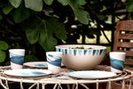 outside table set with bamboo dinner set and large bamboo salad bowl 