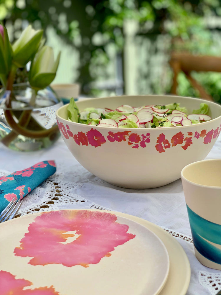 
                  
                    coral coral lprinted dinnerware outside, bamboo bowls and plates 
                  
                