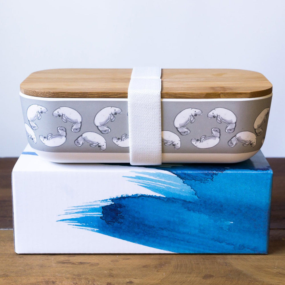 
                  
                    bamboo lunch box  with dugong print  with wooden lid and white elastic band  
                  
                