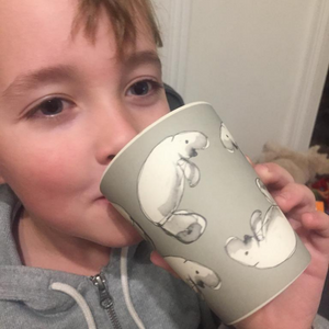
                  
                    boy drinking from dugong bamboo cup
                  
                