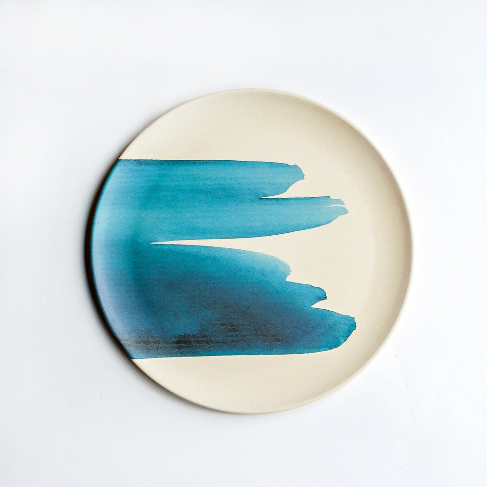 
                  
                    dinner plate with blue wave design
                  
                