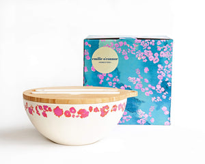 
                  
                    salad bowl with pink coral print around top edge of bowl, printed  coral and blue gift box is styled behind the bowl
                  
                