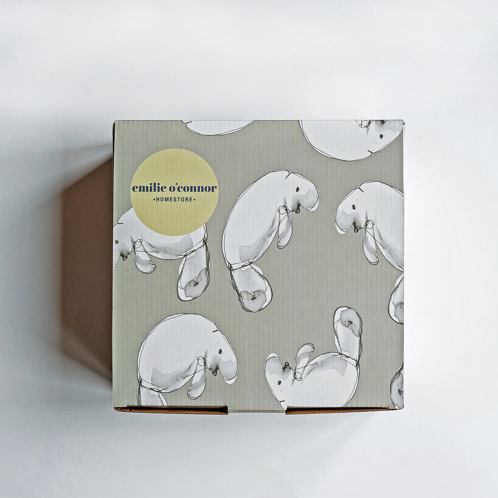 
                  
                    grey and white dugong printed gift box with Emilie O'Connor Homestore branding
                  
                