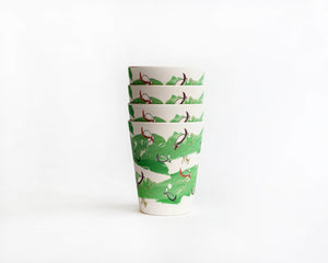 
                  
                    four bamboo cups stacked with green turtle print
                  
                
